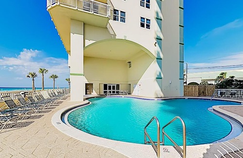 Miramar Beach House | Sunny oceanfront condo with two shared pools hot tub - walk to the beach