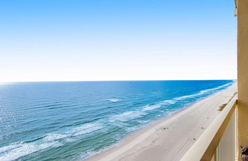 Miramar Beach House | Sunny oceanfront condo with two shared pools hot tub - walk to the beach