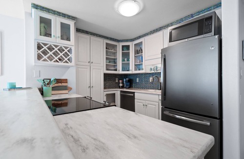 Villa Sabine Condo | Sunset Bay Views! 3 bed, 2 bath End Unit Condo with Pool, Dock and Water Access