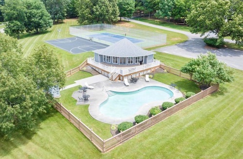 Huddleston House | The full Smith Mountain Lakefront experience: private boat slip, 3 balconies, game room, community pool & beach, propane grill, and pets welcome. No resort fees, ever.