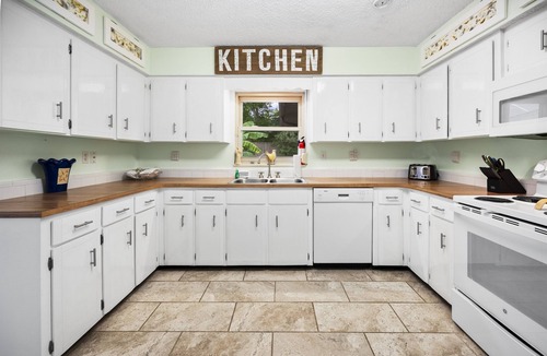 St. Augustine South House | Tropical Pool Retreat - Pet-Friendly, Fenced Yard