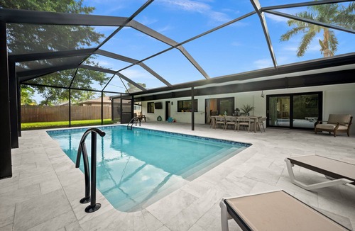 Palm River Estates House | Tropical Retreat Naples, FL - Private heated pool & patio with outdoor living