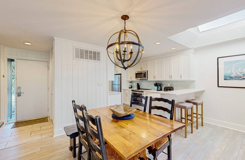 Sea Pines Condo | Updated, waterfront condo with amazing lagoon & golf views from the sunroom