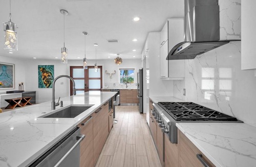 Poinsettia Heights House | Walk to Beach Heated Pool + EV Charger Near Las Olas | Dolphin Isles Oasis