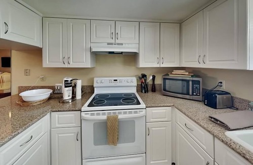 South Island Condo | Waterfront Condo with Private Balcony, Pool, Dock Access.