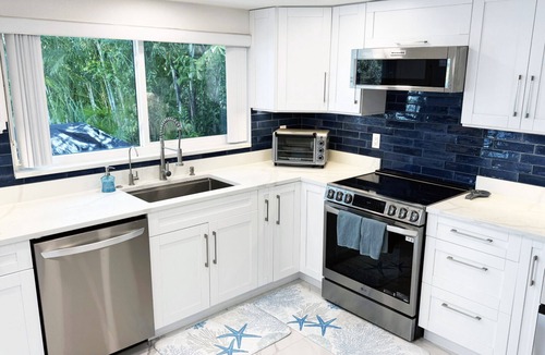 Flor-a-mar House | Waterfront Oasis w/heated Pool Dock Kayaks Fishing