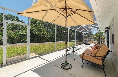 Coquina Sands House | West of 41. Walk 6 minutes to the Lowdermilk beach, theatre, mall and grocery.