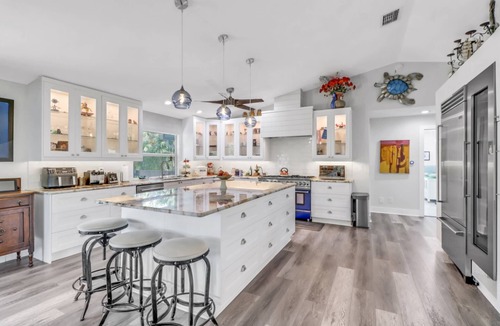 Truckland House | Your Hidden Florida Retreat | 4 King Suites, Luxury Kitchen, Heated Pool & Beach Adventures