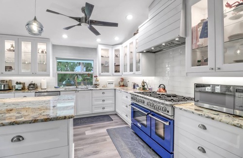 Truckland House | Your Hidden Florida Retreat | 4 King Suites, Luxury Kitchen, Heated Pool & Beach Adventures