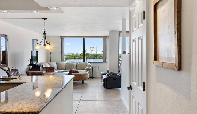 Beautiful updated 3rd floor condo with open floor plan and lovely water views