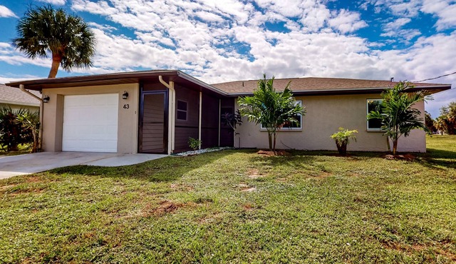Blue sky retreat near the water with updated living quarters, beach gear, and AC