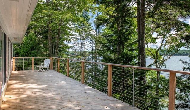 Coastal Hideaway. Water views with expansive deck, pool table, office area.