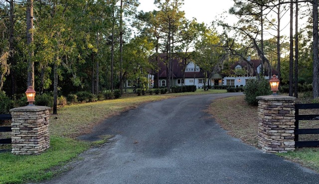 Escape to this serene 4-bedroom home set on 10 private acres.