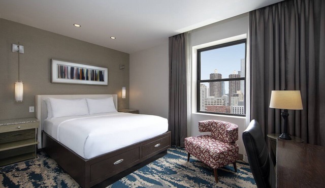 Experience Comfort in Eco-friendly Room w/Earth Tone Furniture