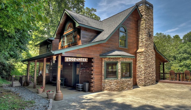 Ideal for large families, this riverfront gem boasts a dock, firepit, hot tub, basketball court, and a pool table for endless fun. Pet Friendly and WiFi