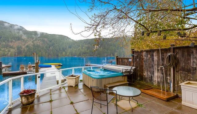 Lakefront home with stunning view, hot tub, dock, decks, firepit & rec room