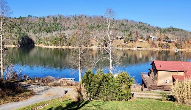 Lakefront Lullaby-Rustic cabin w/lake views, boatslip, hot tub & fiber internet
