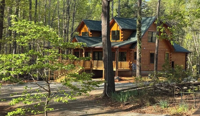Main Channel Lots of Water-All Decked Out — new lakefront log home on Smith Mountain Lake with a private hot tub, 50+ ft of wraparound deck, fire pit patio & easy lake access. Two full kitchens. One of 5 cabins on an 8-acre lakefront micro-resort.