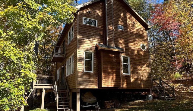 New home steps from Lake George with lake views, swimming access and boat slip