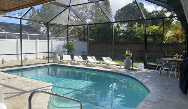 Newly remodeled close to downtown and beaches 3/2 heated pool and screened lanai