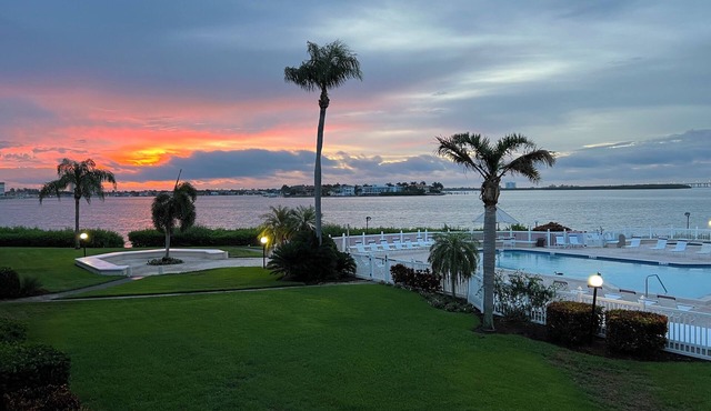 Peaceful Isla del Sol Waterfront Condo with Sunrise Bay Views and Pool
