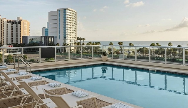 Relax in 4 Elegant Rooms with Rooftop Pool and Poolside Umbrellas