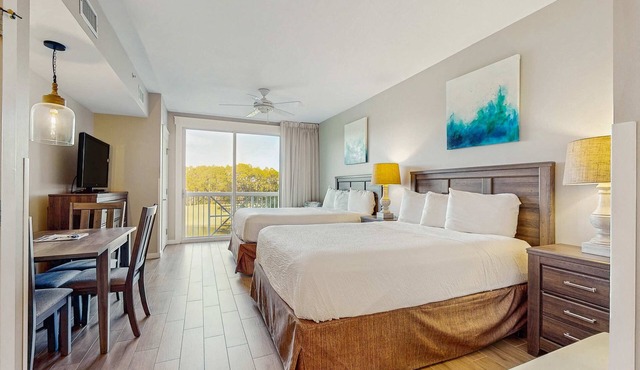 Renovated studio with pool, hot tub, full sized fridge, and 2 burner stovetop