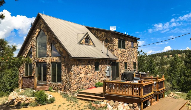 Secluded home on 5 acres with great mountain views, decks, wood stove & W/D