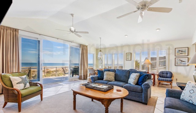 Spacious living area, windows across entire length of home.