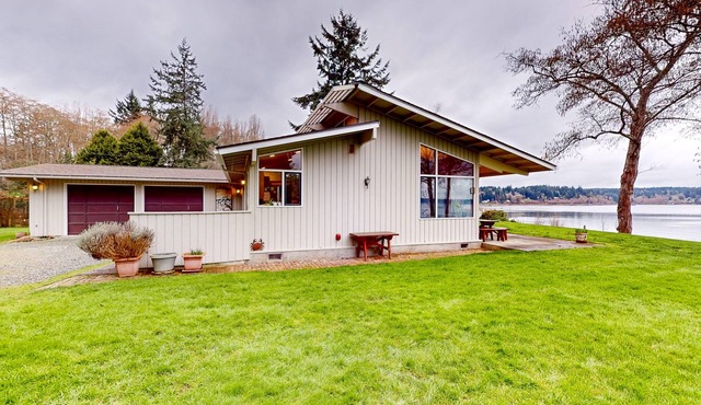 Stunning waterfront escape with patio, beach access, & gorgeous bay views