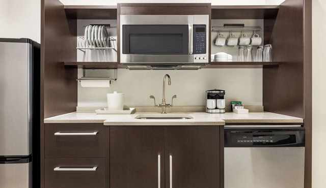 Sunlit Queen Studio Suite w/Expansive City Views & a Clean, Contemporary Design