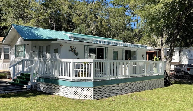 Super roomy Park Model in premier resort with lake, pools, dock and boat launch.