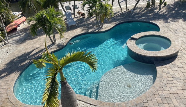 Times Square Gem! 4BR Canal front home, private Pool/Spa, Sleeps 12