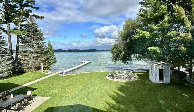 Torch Lake Waterfront-crystal clear water, huge dock, shallow sandy walk-out