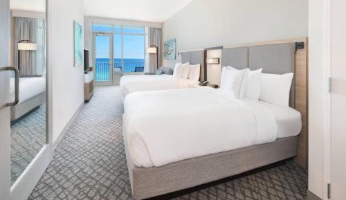Queen Suite with Two Queen Beds, Beachfront View, One Set of Bunk Beds and Sofa Bed