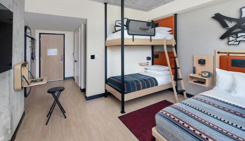 Room with One Queen Bed and Bunk Beds